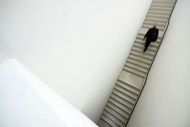 A visitor goes upstairs during the press preview prior to the opening of the new Bauhaus Museum of the “Klassik Stiftung Weimar” (Classic Foundation Weimar) in Weimar, Germany, Thursday, April 4, 2019. The museum designed by Berlin-based architect Heike Hanada will focus on the early Bauhaus that was founded in Weimar in 1919 and stayed there until 1925. The official opening of the new Bauhaus Museums will take place on Friday, April 5, 2019. (Photo by Jens Meyer/AP Photo)