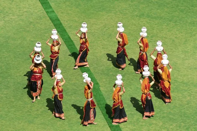 Folk dancers perform during the golden jubilee celebrations of Gujarat Co-Operative Milk Marketing Federation (GCMMF), owner of the flagship dairy brand Amul at the Narendra Modi Stadium in Ahmedabad on February 22, 2024. (Photo by Sam Panthaky/AFP Photo)