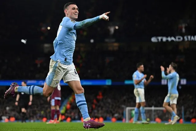 Manchester City's English midfielder #47 Phil Foden celebrates after scoring his team thrid goal during the English Premier League football match between Manchester City and Aston Villa at the Etihad Stadium in Manchester, north west England, on April 3, 2024. (Photo by Paul Ellis/AFP Photo)