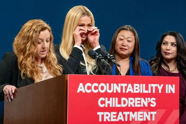 Hotel heiress and media personalty Paris Hilton, second from left, wipes her eyes as state Sen. Angelique Ashby, D-Sacramento, left, talks in support of a proposed bill calling on more transparency for youth treatment facilities during a news conference in Sacramento, Calif., Monday, April 15, 2024. Looking on are Republican state Sen. Janet Nguyen, second from right and Democratic state Sen. Susan Rubio. (Photo by Rich Pedroncelli/AP Photo)