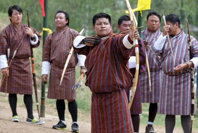 Archers take part in a competition in Thimphu, Bhutan, April 18, 2016. (Photo by Cathal McNaughton/Reuters)