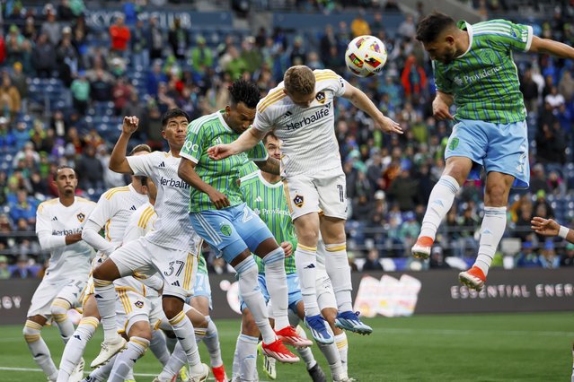 Seattle Sounders FC midfielders Léo Chú, left, and Cristian Roldan, far right, try to get on the end of a corner kick against Los Angeles Galaxy midfielder Daniel Aguirre (37) and defender John Nelson during the second half of an MLS soccer match, Sunday, May 5, 2024, in Seattle. (Photo by Jennifer Buchanan/The Seattle Times via AP Photo)