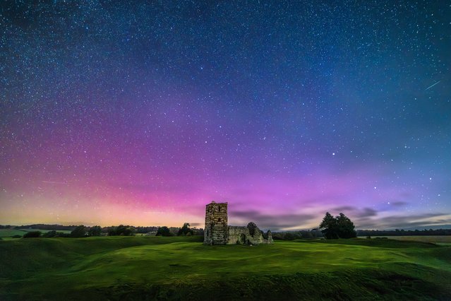 The northern lights reached as far south as Dorset, UK on Monday, September 25, 2023, seen over Knowlton Church near Wimborne during the night. (Photo by Cenk Albayrak-Touye/Picture Exclusive)