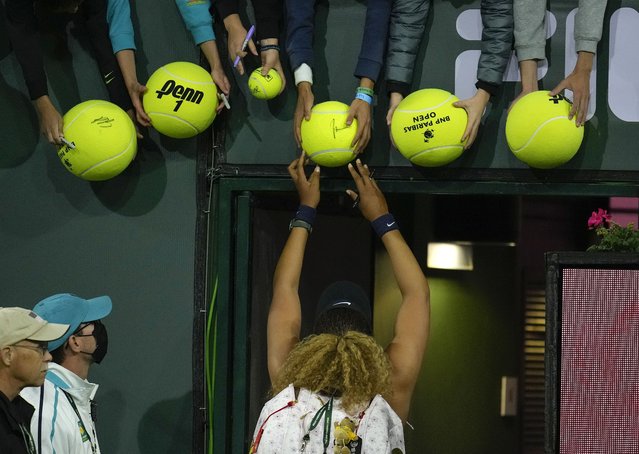 Naomi Osaka of Japan signs autographs after losing against Veronika Kudermetova of Russia during the BNP Paribas Open tennis tournament at the Indian Wells Tennis Garden in Indian Wells, California, USA, 12 March 2022. (Photo by Ray Acevedo/EPA/EFE)