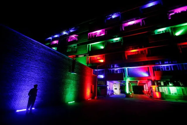 A policeman stands in front of the secretariat building illuminated by colourful lights during Diwali, the Hindu festival of lights, celebrations in Chandigarh, India, October 27, 2019. (Photo by Ajay Verma/Reuters)