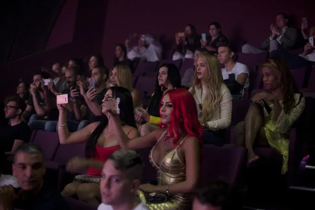 People in the crowd watch the first Miss Trans Israel beauty pageant on May 27, 2016 in Tel Aviv, Israel. Twelve Israeli transgender finalists took part in the event. The event marks the beginning of the 2016 Pride events. (Photo by Lior Mizrahi/Getty Images)