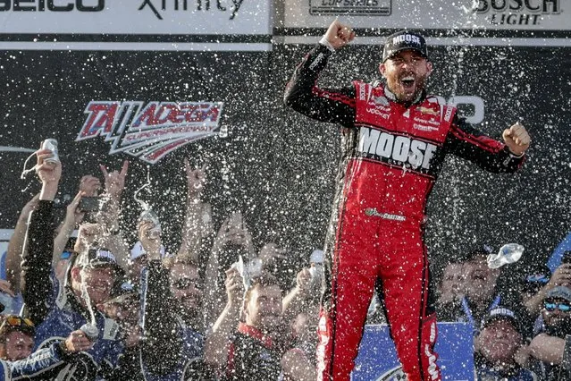 NASCAR Cup Series driver Ross Chastain (1) celebrates the win in Victory Lane following a NASCAR Cup Series auto race, Sunday, April 24, 2022, in Talladega, Ala. (Photo by Butch Dill/AP Photo)