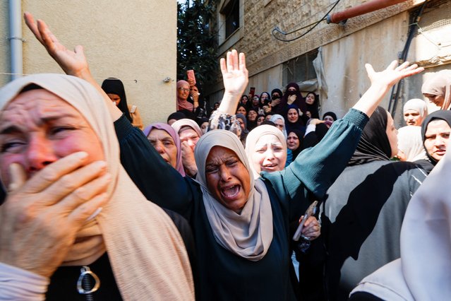 Mourners react during the funeral of three Palestinians, who were killed in an Israeli raid, in Aqaba near Tubas, in the Israeli-occupied West Bank, on August 6, 2024. (Photo by Raneen Sawafta/Reuters)