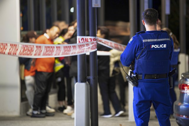 Police tape cordons off a restaurant in Auckland, New Zealand, Tuesday, June 20, 2023, after an axe attack late Monday. Multiple people were hospitalized after a man armed with an axe began attacking diners at random at three neighboring Chinese restaurants, according to police and witnesses. (Photo by Hayden Woodward/New Zealand Herald via AP Photo)