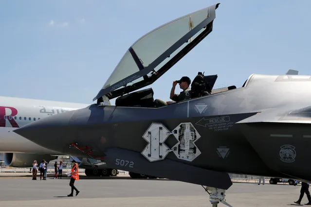 A U.S. airman adjusts his cap in the cockpit as a Lockheed Martin F-35 Lightning II aircraft is moved on the eve of Paris Air Show at Le Bourget, Paris on June 18, 2017. (Photo by Pascal Rossignol/Reuters)