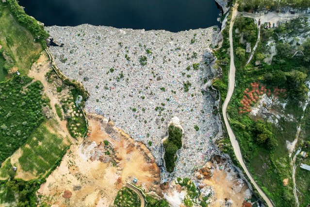 An aerial photograph shows the polluted Mittaganahalli lake on the outskirts of Bengaluru on September 3, 2024. (Photo by Idrees Mohammed/AFP Photo)