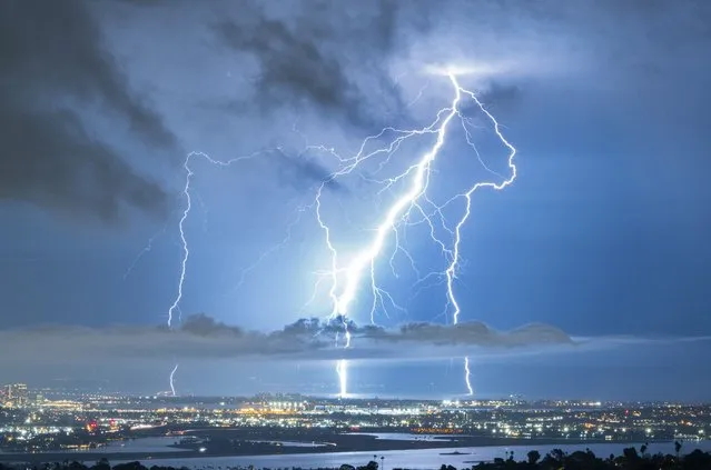 Lighting strikes the ground near downtown San Diego and Coronado during a lighting storm on October 4, 2021. (Photo by K.C. Alfred/ZUMA Press Wire/Rex Features/Shutterstock)