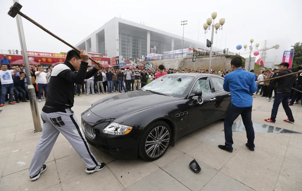 Man Smashes his Maserati in Protest in China