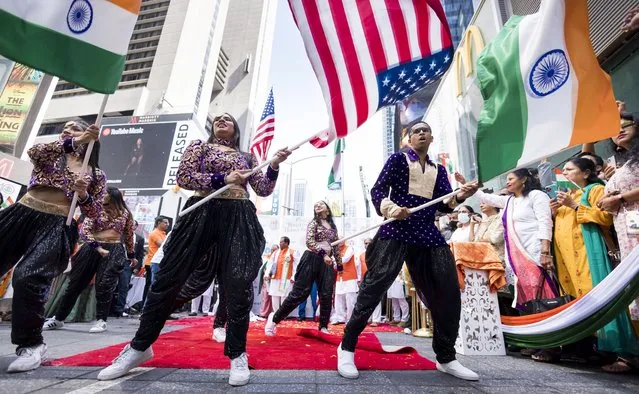 Dancers perform during a ceremony celebrating the 75th anniversary of India’s Independence Day in Times Square in New York, New York, USA, 15 August 2022. India was declared independent from British colonialism on 15 August 1947. (Photo by Justin Lane/EPA/EFE)