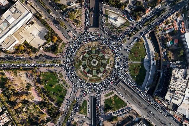 This aerial view shows traffic at Damascus' central Umayyad Square on December 10, 2024. (Photo by Bakr Alkasem/AFP Photo)