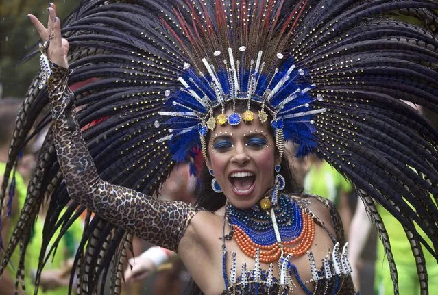 A performer takes part in the Notting Hill Carnival in west London August 25, 2014. (Photo by Neil Hall/Reuters)