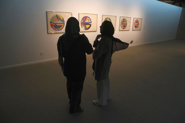 Two women visit a 19th and 20th-century American and European minimalist and conceptual masterpieces show at the Tehran Museum of Contemporary Art in Tehran, Iran, Tuesday, August 2, 2022. Some of the world’s most prized works of contemporary Western art have been unveiled for the first time in decades – in Tehran. (Photo by Vahid Salemi/AP Photo)