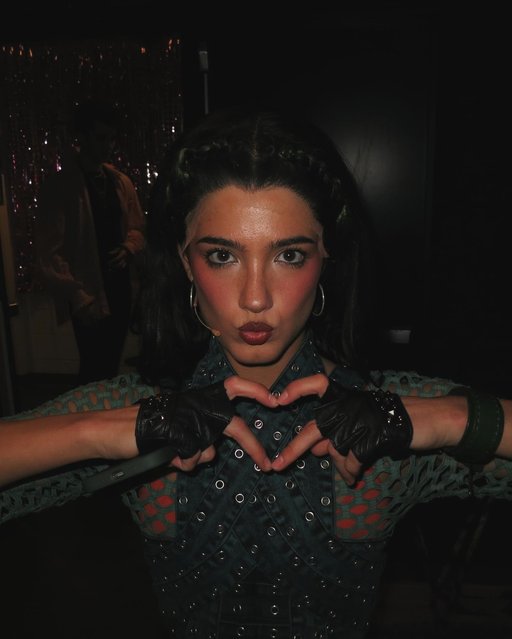 American media personality and dancer Charli D’Amelio throws up some heart hands backstage at “&Juliet” in NYC on January 19, 2025. (Photo by charlidamelio/Instagram)