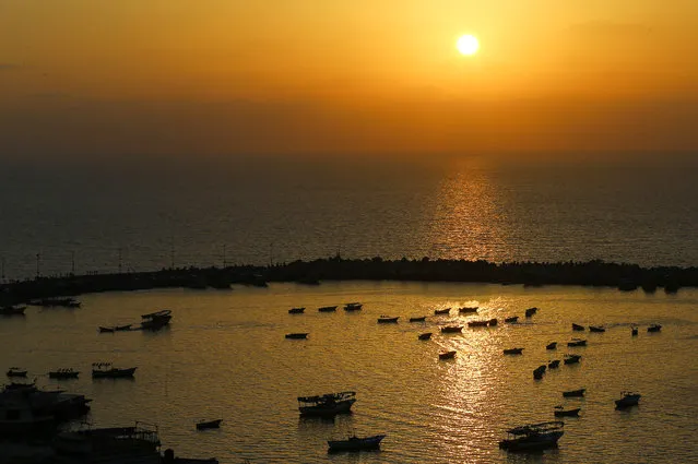 A picture taken on May 5, 2017 shows a general view of the boats moored in the seaport of Gaza City at sunset. (Photo by Mohammed Abed/AFP Photo)