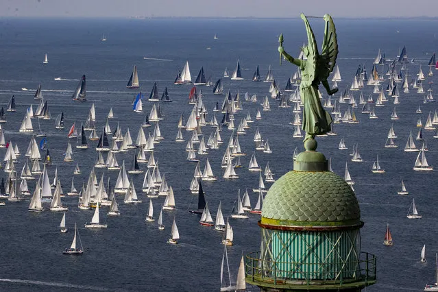A view of the sailing boats participating in the 54th edition of the traditional “Barcolana” regatta, in the Gulf of Trieste, north-eastern Italy, Sunday, October 9, 2022. In foreground, the “Victory Lighthouse”. (Photo by Paolo Giovannini/AP Photo)