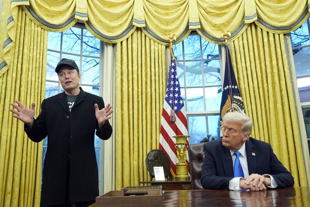 President Donald Trump listens as Elon Musk speaks in the Oval Office at the White House, Tuesday, February 11, 2025, in Washington. (Photo by Alex Brandon/AP Photo)