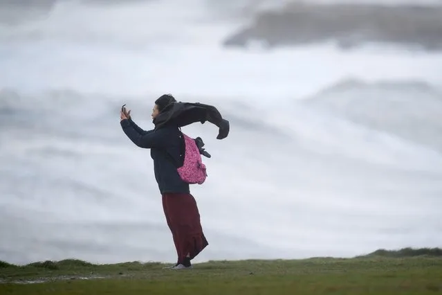This keen photographer could not help but take a “storm selfie” in Porthcawl, South Wales, England this morning, October 22, 2017 – but officials urge Britons to avoid risking their safety. (Photo by Wales News Service)