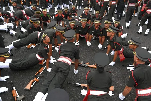 Indian army cadets do pushups as they celebrate after their graduation ceremony at the Officers Training Academy (OTA) in Chennai October 29, 2022. (Photo by Arun Sankar/AFP Photo)
