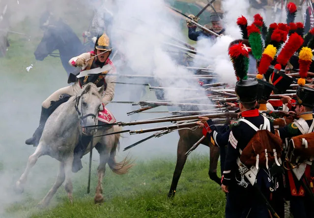 Participants reenact the 1812 Battle of Borodino between Russia and the invading French army during anniversary celebrations in Moscow region, Russia, September 4, 2016. (Photo by Sergei Karpukhin/Reuters)