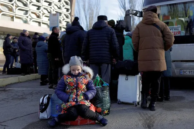 Residents wait to get on an evacuation bus, after Russia's military retreat from Kherson, at the central bus station in Kherson, Ukraine on November 23, 2022. (Photo by Murad Sezer/Reuters)