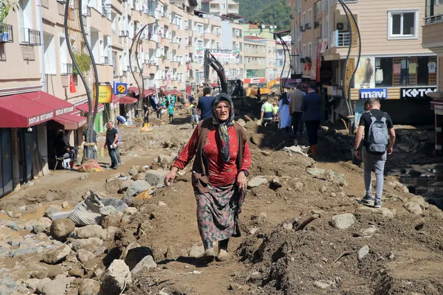 People are seen in the area hit by floods following heavy rains in Dereli district of Turkeyâs Black Sea province of Giresun on August 24, 2020. (Photo by Baris Oral/Anadolu Agency via Getty Images)