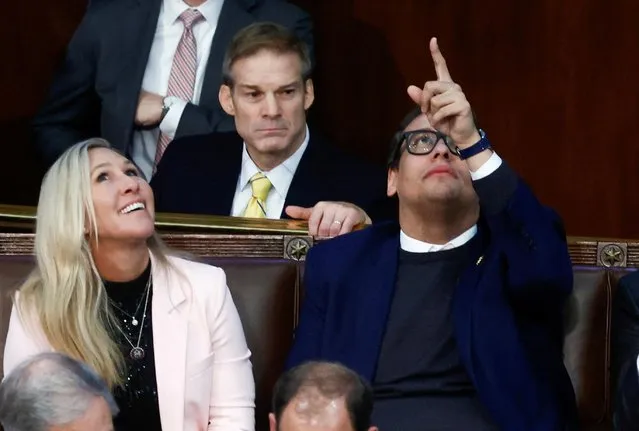 Newly elected freshman Rep. George Santos (R-NY), facing a scandal over his resume and claims he made on the campaign trail, points to the ceiling of the House Chamber as he talks with Rep. Jim Jordan (R-OH) and Rep. Marjorie Taylor Greene (R-GA) during a 9th round of votes for the new Speaker of the House on the third day of the 118th Congress at the U.S. Capitol in Washington, U.S., January 5, 2023. (Photo by Evelyn Hockstein/Reuters)