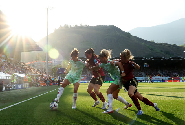 Cristiana Girelli and Emma Severini of Italy battle for possession with Marie Detruyer and Sarah Wijnants of Belgium during the UEFA Women's EURO 2025 Group B match between Belgium and Italy at Stade de Tourbillon on July 03, 2025 in Sion, Switzerland. (Photo by Eddie Keogh/Getty Images)