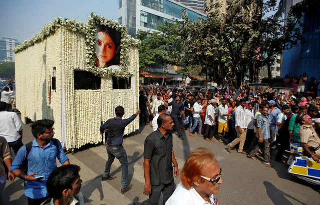 The body of Bollywood actress Sridevi is carried in a truck during her funeral procession in Mumbai, February 28, 2018. (Photo by Francis Mascarenhas/Reuters)