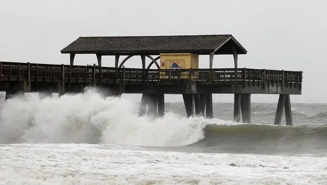 Waves pound the pier as Hurricane Matthew approaches on Tybee Island, Georgia, October 7, 2016. (Photo by Tami Chappell/Reuters)