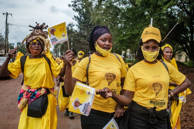 Supporters of Ugandan President Yower Museveni are seen during a rally in Jinja, Uganda, on December 4, 2020, complying with COVID-19 regulations and wearing masks. Elections in Uganda will take place on January 14, 2021, and will see Ugandan President Yoweri Museveni run for his sixth term in office, after being in power for 34 years. (Photo by Sumy Sadurni/AFP Photo)