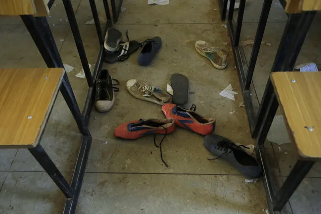 Shoes of the kidnapped students from Government Science Secondary School are seen inside their class room Kankara, Nigeria, Wednesday, December 16, 2020. Rebels from the Boko Haram extremist group claimed responsibility Tuesday for abducting hundreds of boys from a school in Nigeria's northern Katsina State last week in one of the largest such attacks in years, raising fears of a growing wave of violence in the region. (Photo by Sunday Alamba/AP Photo)
