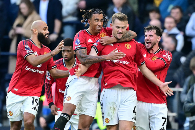 Manchester United's Dutch defender #04 Matthijs de Ligt (2R) celebrates with teammates after scoring their late second goal during the English Premier League football match between Tottenham Hotspur and Manchester United at the Tottenham Hotspur Stadium in London, on November 8, 2025. (Photo by Ben Stansall/AFP Photo)