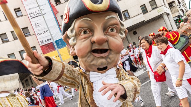 A performer dressed as “cabezudo” participates during the “Gigantes y Cabezudos” parade during the San Fermin festival on July 09, 2024 in Pamplona, Spain. (Photo by Aldara Zarraoa/Getty Images)