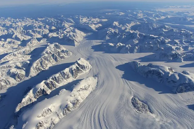 Heimdal Glacier in southern Greenland is seen in a NASA image captured by Langley Research Center's Falcon 20 aircraft October 13, 2015 and released November 24, 2015.  NASA's Operation IceBridge North is an airborne survey of polar ice aimed at learning how much snow and ice disappeared over the summer, according to a NASA news release. (Photo by John Sonntag/Reuters/NASA)