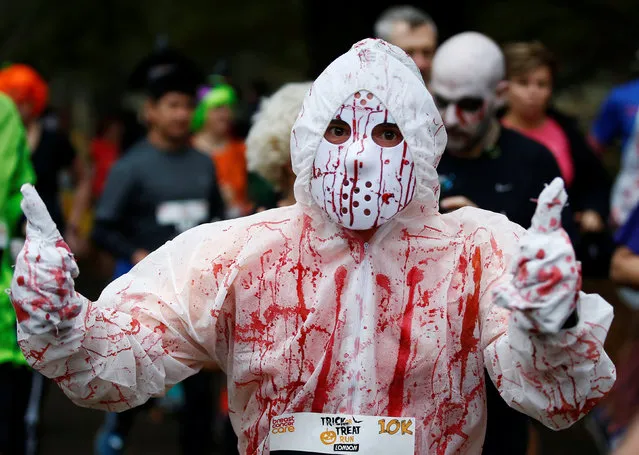 A participant takes part in a Trick or Treat halloween fun run in Richmond Park, London, Britain October 30, 2016. (Photo by Peter Nicholls/Reuters)