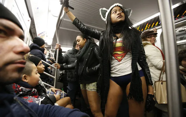 Jessica Faustin, of Queens, New York, participates in the annual No Pants Subway Ride, Sunday, January 11, 2015, in New York. (Photo by Kathy Willens/AP Photo)