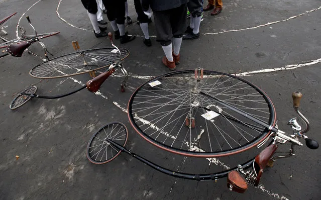 Participants wearing historical costumes stand next to their high-wheel bicycles before the annual penny farthing race in Prague, Czech Republic November 5, 2016. (Photo by David W. Cerny/Reuters)