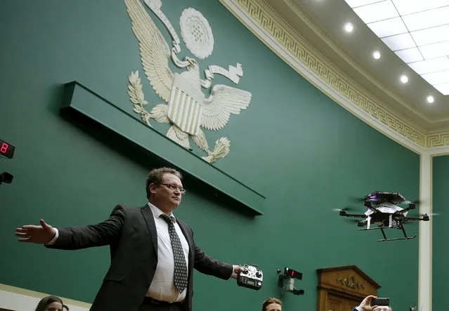 Jan Stumpf of Ascending Technologies controls an Intel AscTec Firefly drone during a flight demonstration at the House Commerce, Manufacturing and Trade subcommittee on Capitol Hill in Washington November 19, 2015. (Photo by Gary Cameron/Reuters)