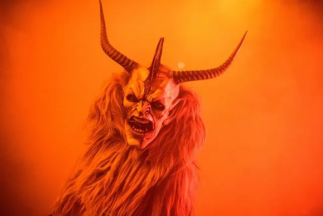 A person dressed as the Krampus performs during the 9th Krampus meeting show in Serfaus, Tyrol, Austria, 12 November 2016. (Photo by Christian Bruna/EPA)