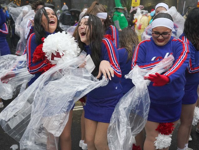 Rain falls as performers prepare to take part in the New Year's Day Parade in central London on Wednesday, January 1, 2025, as wind, rain and snow warnings are in force across parts of the UK, with the threat of flooding and disruption to New Year's Day travel. Large parts of England and Wales will be hit by strong winds until 3pm on Wednesday, while north-west England and Wales are forecast to see heavy rain for much of the morning. (Photo by Jonathan Brady/PA Images via Getty Images)
