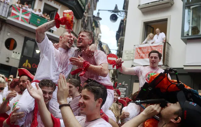Revellers celebrate during the opening of the San Fermin festival in Pamplona, Spain on July 6, 2018. (Photo by Susana Vera/Reuters)