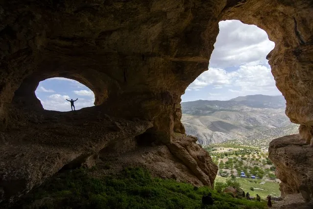 A view from a cliff near cave, where 81 year-old Sukru Kurt's been living for years, at Levent Valley in Kucukkurne village of Akcadag district of Malatya, Turkiye on June 19, 2023. The cave is surrounded by other caves with ruins and remains from the Neolithic Ages. (Photo by Bayram Ayhan/Anadolu Agency via Getty Images)