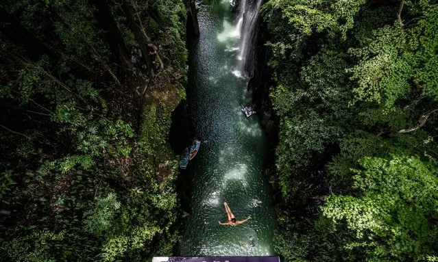In this handout image provided by Red Bull, Eleanor Smart of the USA dives from the 21 metre platform during the final competition day of the fourth stop of the Red Bull Cliff Diving World Series on August 03, 2023 at Takachiho, Japan. (Photo by Dean Treml/Red Bull via Getty Images)