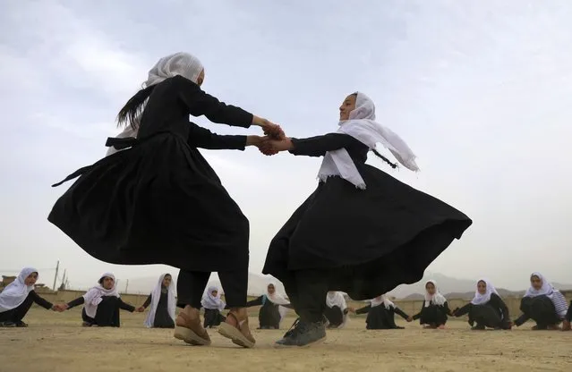 Afghan students play in a primary school in Kabul, Afghanistan, Saturday, March 27, 2021. (Photo by Rahmat Gul/AP Photo)