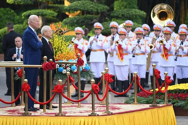 US President Joe Biden attends a welcoming ceremony hosted by Vietnam's Communist Party General Secretary Nguyen Phu Trong (2L) at the Presidential Palace of Vietnam in Hanoi on September 10, 2023. Biden travels to Vietnam to deepen cooperation between the two nations, in the face of China's growing ambitions in the region. (Photo by Saul Loeb/AFP Photo)